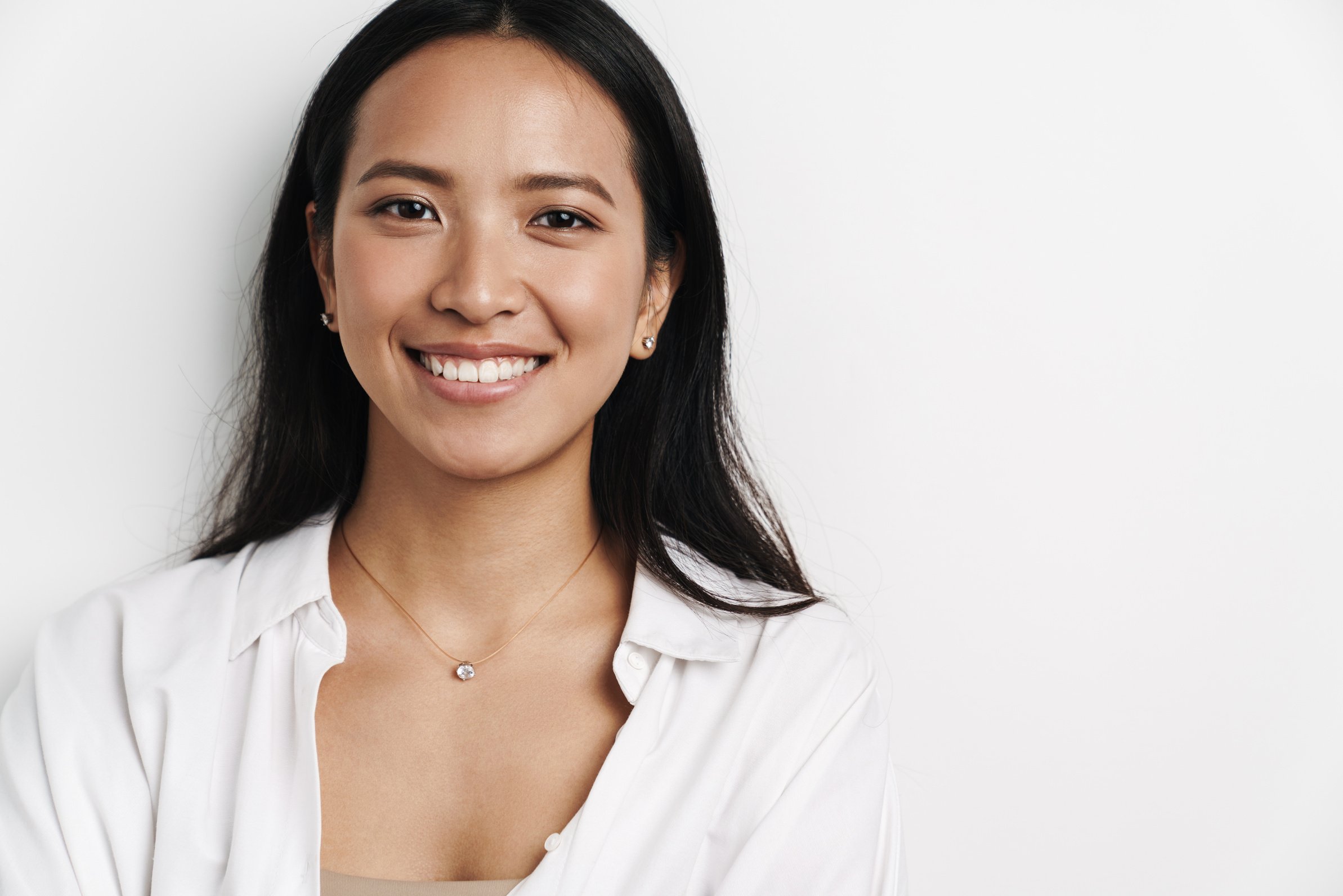 Beautiful Happy Asian Woman Smiling and Looking at Camera